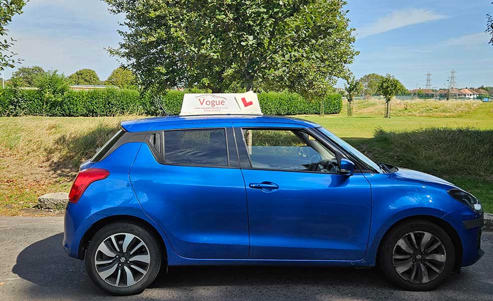 driving test car blue with vogue signage